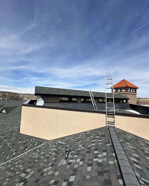 Commercial flat roof with rooftop equipment and a ladder